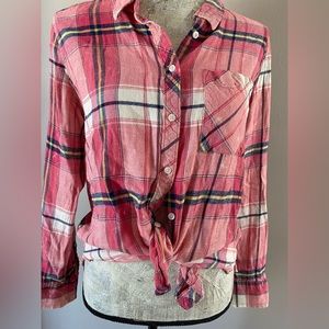 Pink plaid button down shirt.